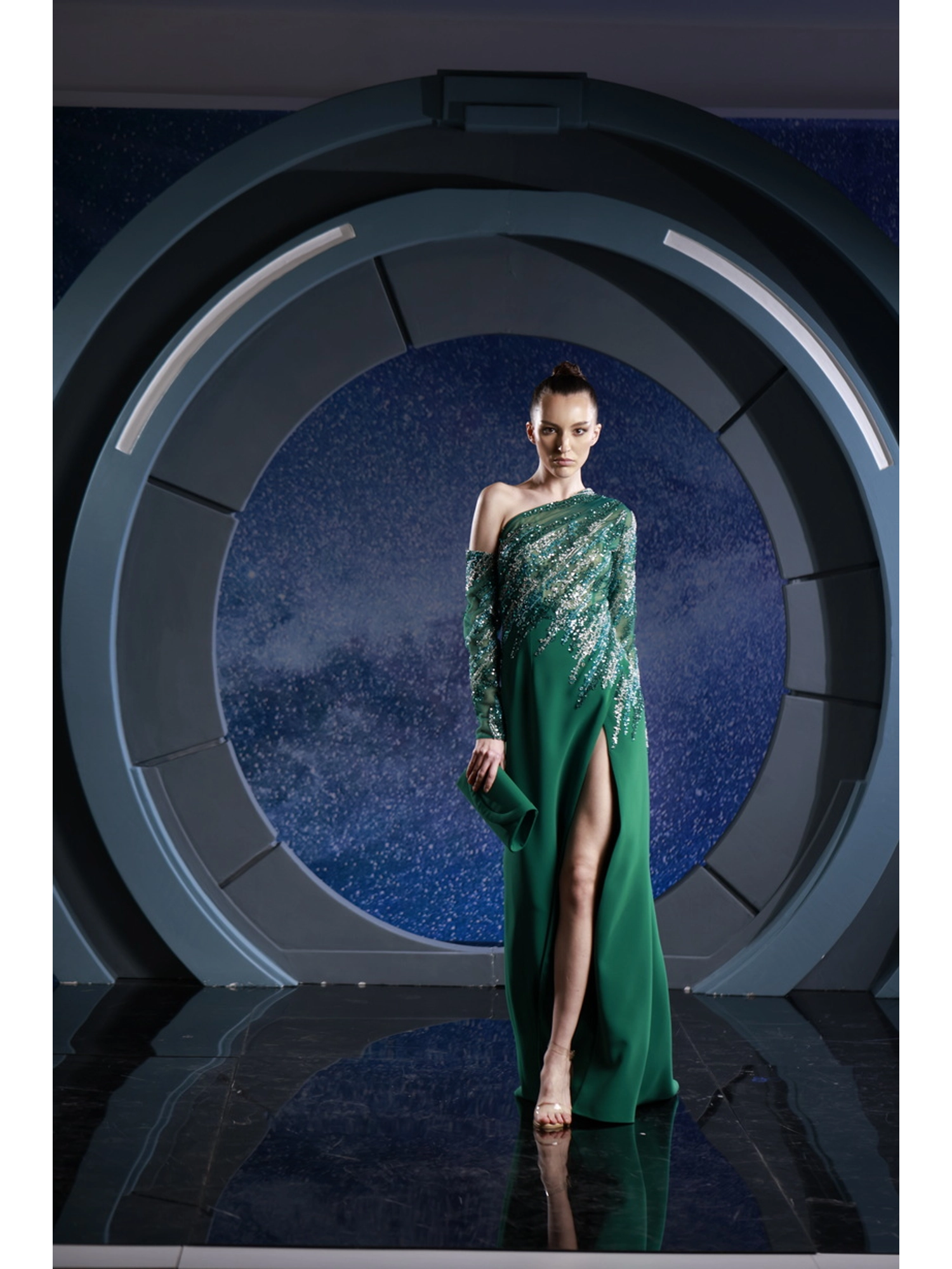 FW 124 - Emerald dress featuring a sleek crepe skirt with a chic slit,  paired with a mix of green beaded top.Emerald Green US 01